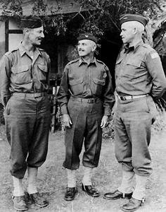 Photo:  Lt. Gen. Omar Bradley, II Corps commander, consults with staff members. Bradley assumed command of II Corps, his first combat command, in April 1943 and led it through the rest of the North African campaign and the fighting in Sicily. 
