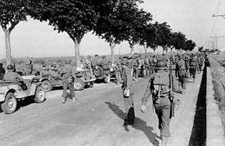 American infantrymen advancing along Highway 6 toward Rome.