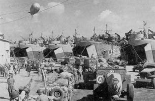 45th Infantry Division troops load up at Bagnoli, Italy, August 1944.
