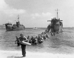 Troops of the 45th Division wade ashore near St. Maxime.