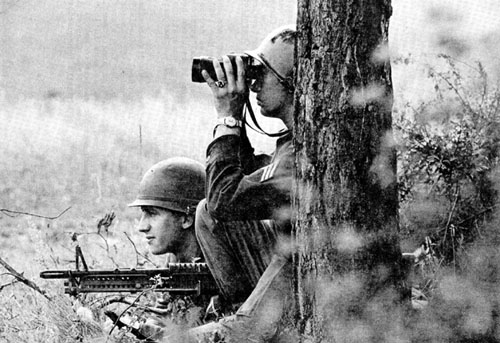Photo: Soldiers from the 3d Armored Cavalry Regiment man a temporary observation post next to the border. August 1962.
