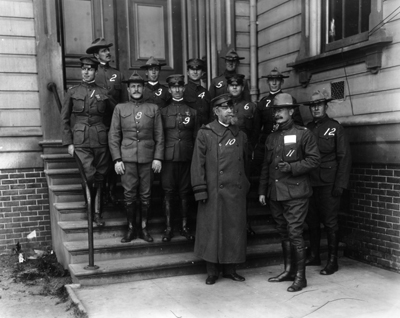 Photo:  SC95084 - Military officers who participated in the San Francisco Earthquake relief operations: Back Row (left to right they are numbered 1 through 7) Captain William Mitchell, Captain W.W. Hartz, Captain L.W. Oliver, Captain R.E. Logan, 2nd Lieutenant J.R Benedict, Captain J.F. Madden, and 2nd Lieutenant E.S. Adams.  Front Row (left to right they are numbered 8 through 12) 1st Lieutenant H.H. Scott, Captain R.S. Sorley, Major General A. W. Greely, Lieutenant Colonel Lea Febiger, and Captain F.D. Ely. 