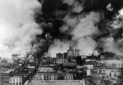Photo:  SC95197 - Vivid picture showing flames of San Francisco fire in the area east of Sansome Street; north of Bush Street, south of Jackson Street, and west of Embarcadero Street. The unburned area shown here is the Chinatown District.