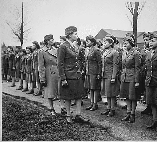 Major Charity Adams, Commander, and Captain Abbie Campbell, Executive Officer, inspect the 6888th Central Postal Directory Battalion, in England in February 1945. Source: National Archives and Records Administration.