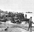 Rhino ferry discharging ordnance troops and supplies on a Normandy beach