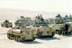FV 432-series armored personnel carriers in foreground.